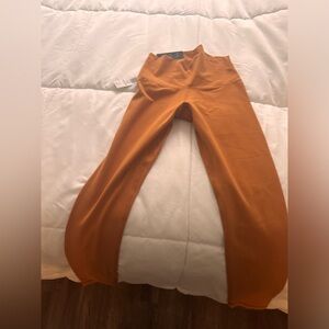 TNA Butter leggings in XS with tags never worn color orange liqueur